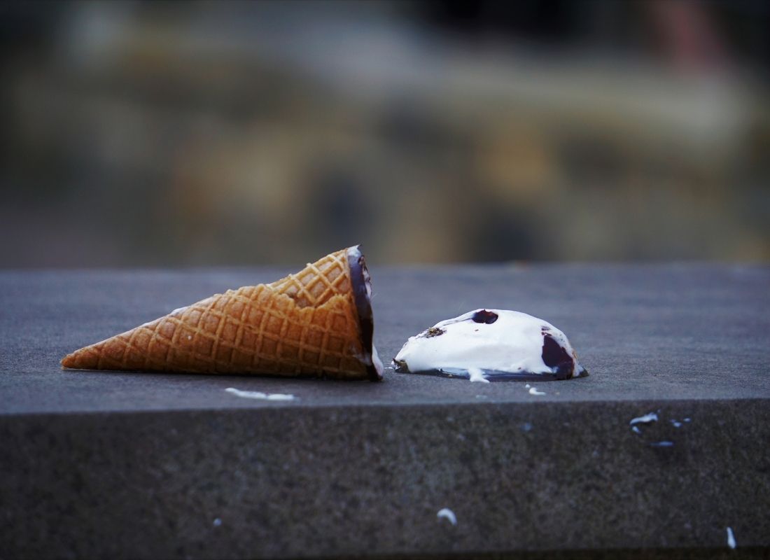 Spilled ice cream cone on ground