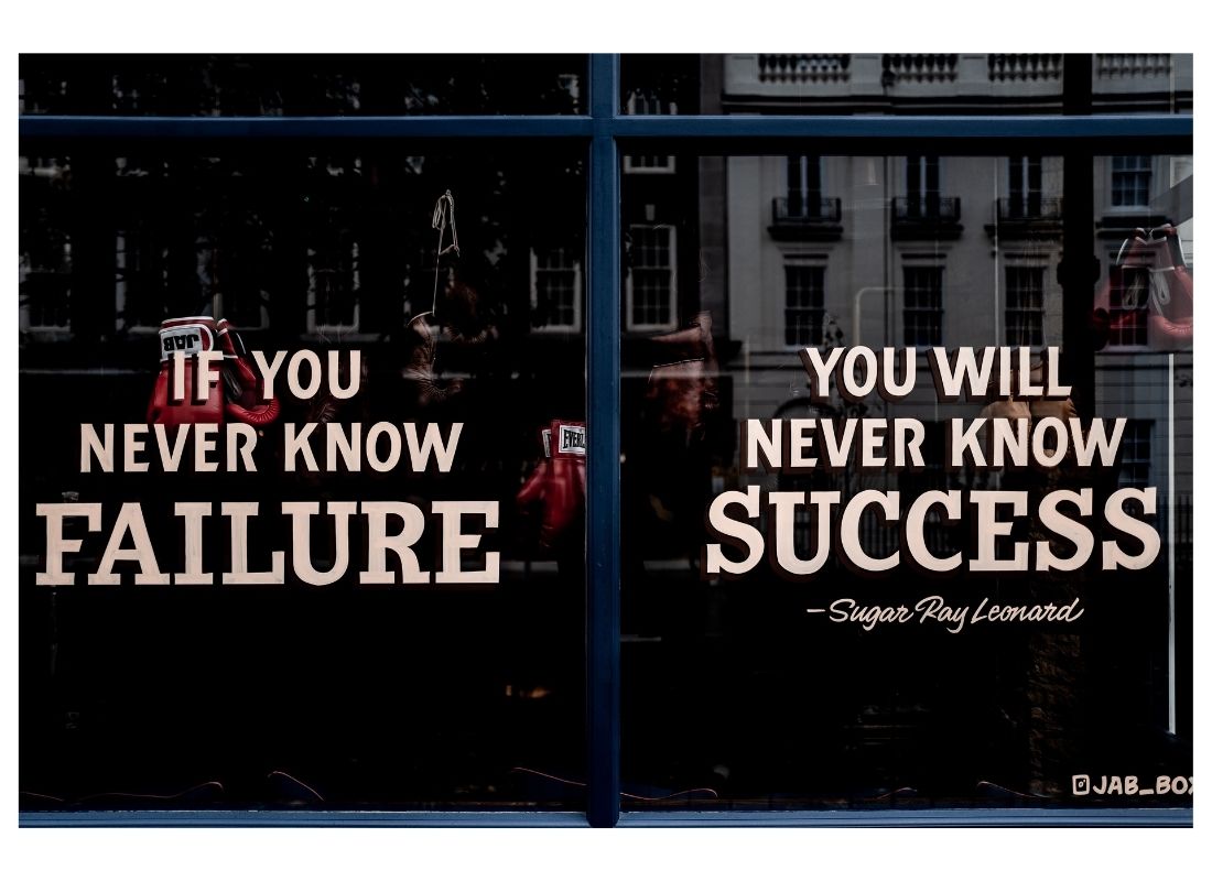 failure quote printed on shop window