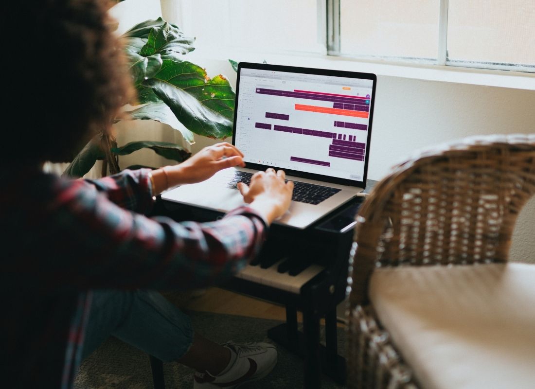 Woman checking work calendar on laptop