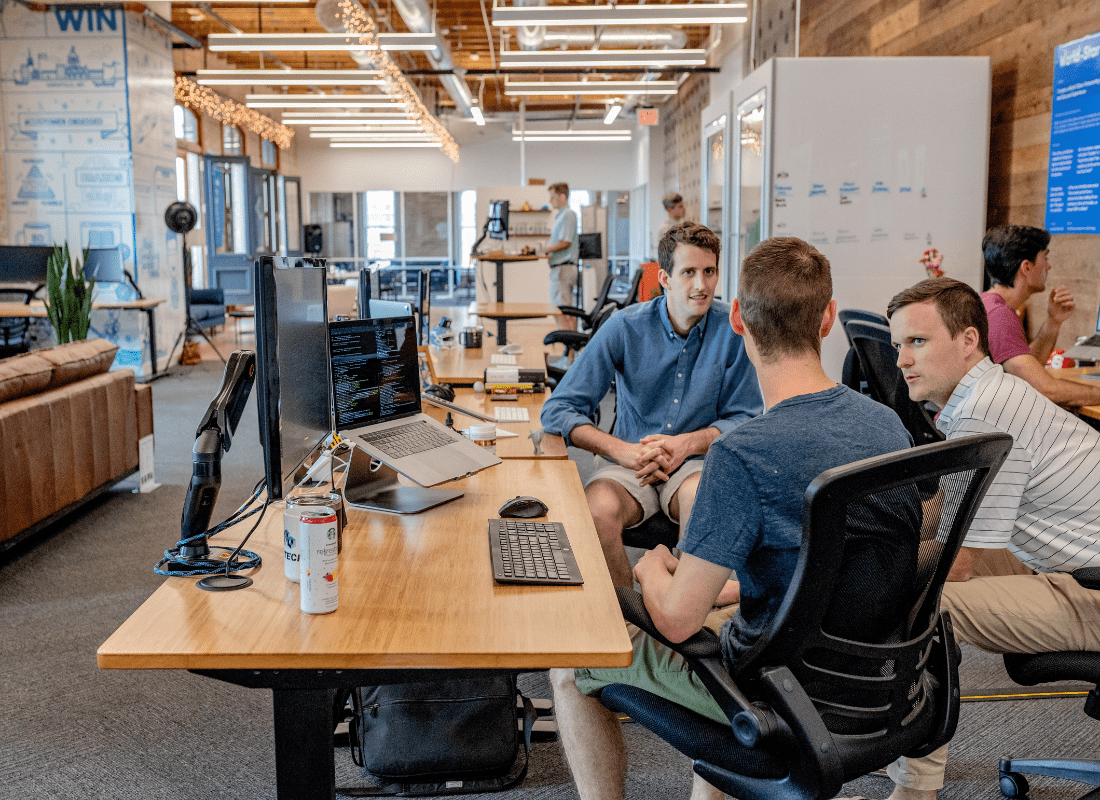 Boss gaining employee buy in in company meeting room